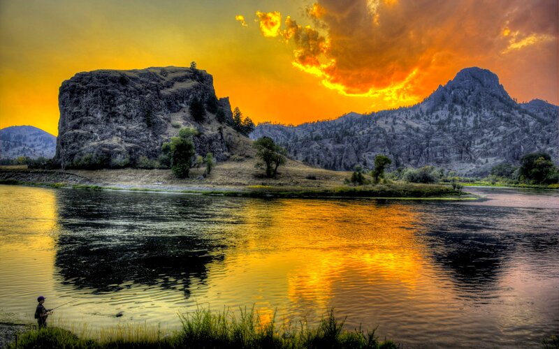 Fisherman on Riverbank — Orange