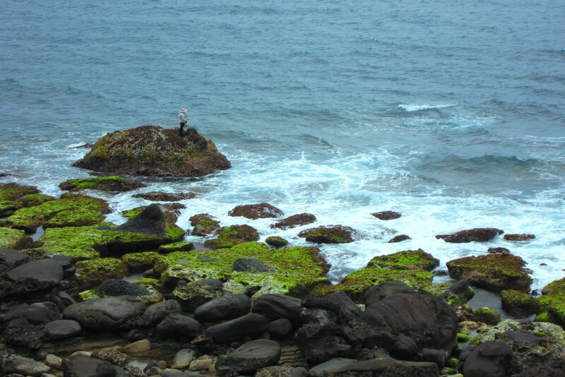 Fisherman on Rocky Shore — Blue