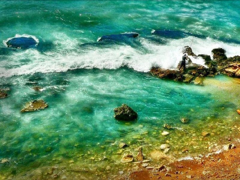 Fisherman on Rocky Shore — Turquoise