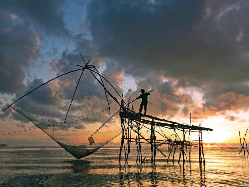 Fisherman on Wooden Platform
