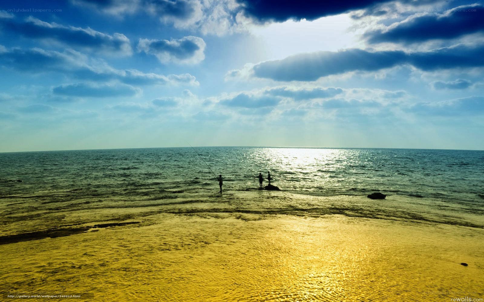 Fishermen at sunset on the beach