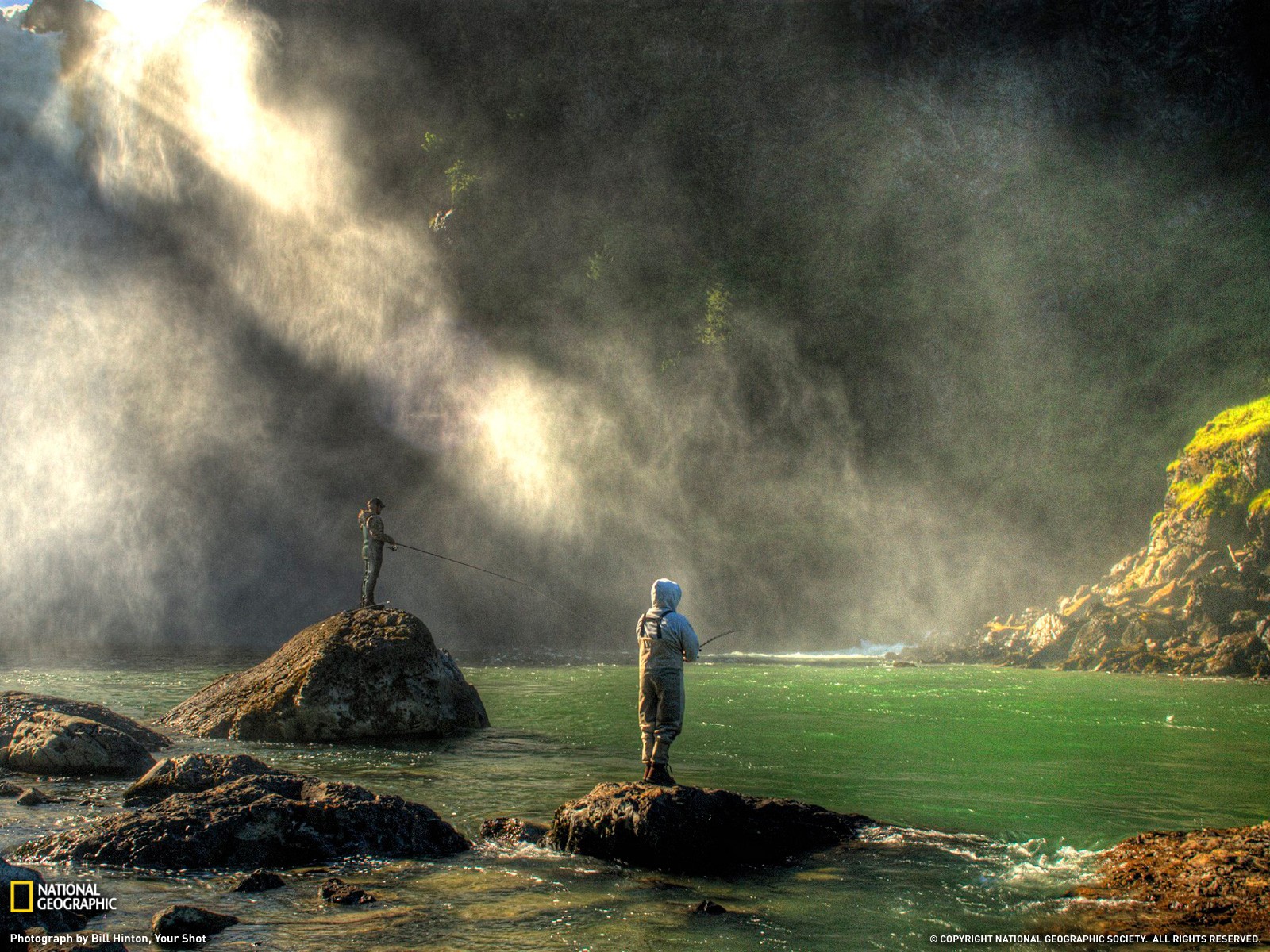Fishermen by a waterfall