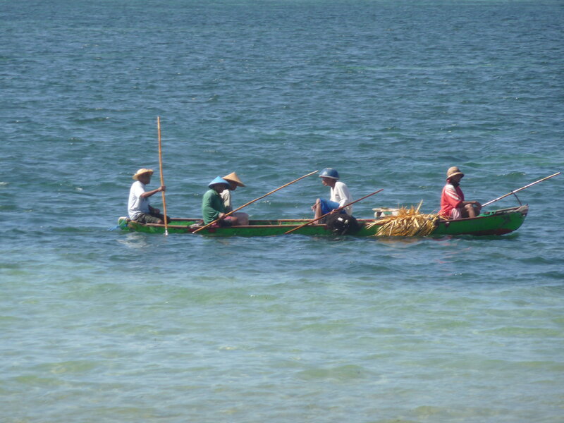 Fishermen in a boat on the water