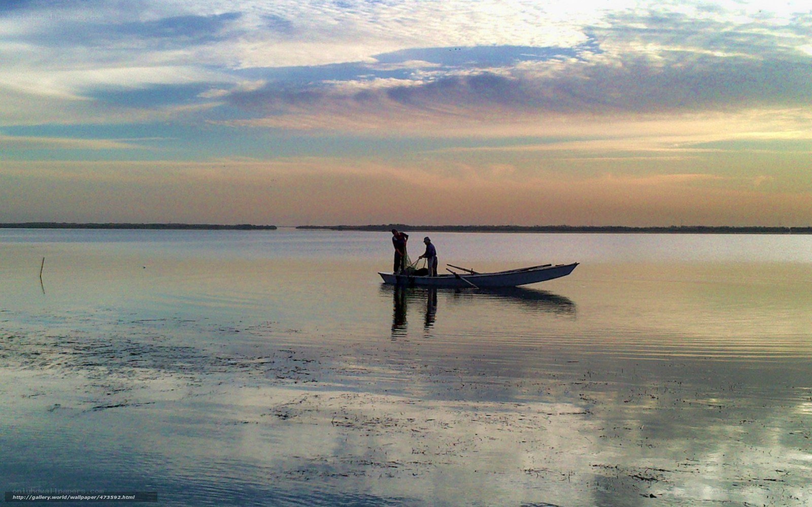 Fishermen on a calm lake