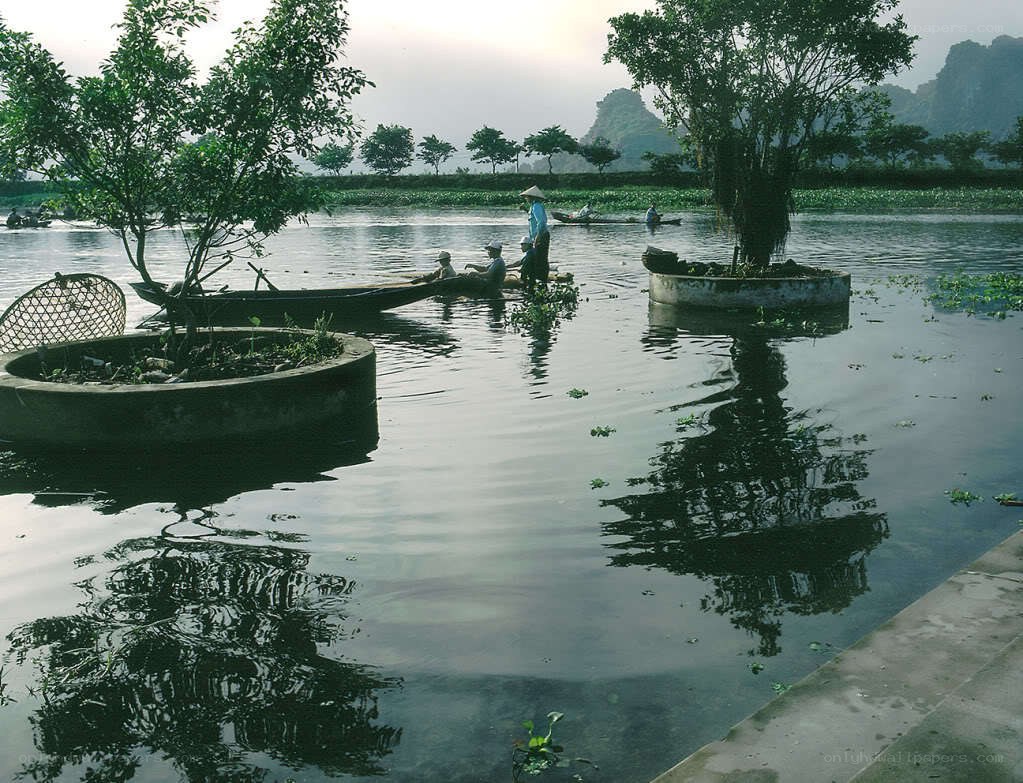 Fishermen on a calm river