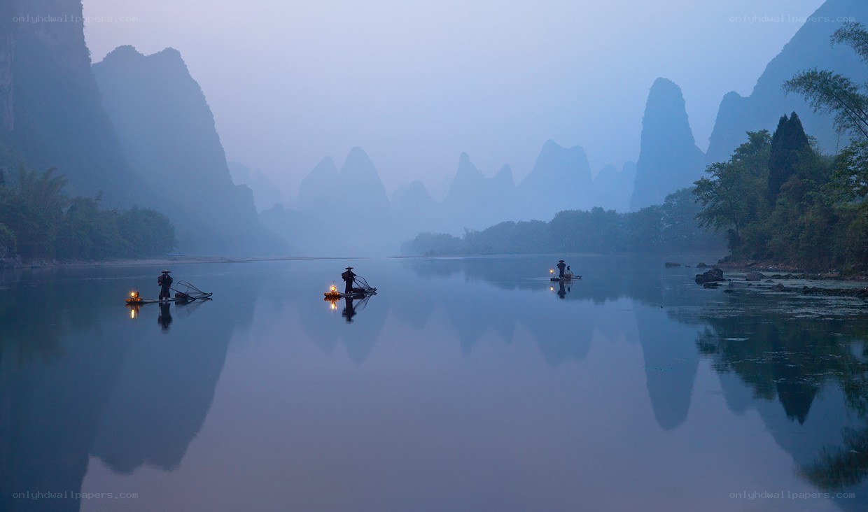 Fishermen on a misty river