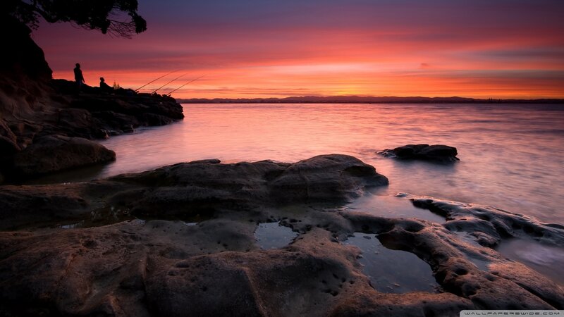 Fishermen on Rocky Shore — Orange, Serene