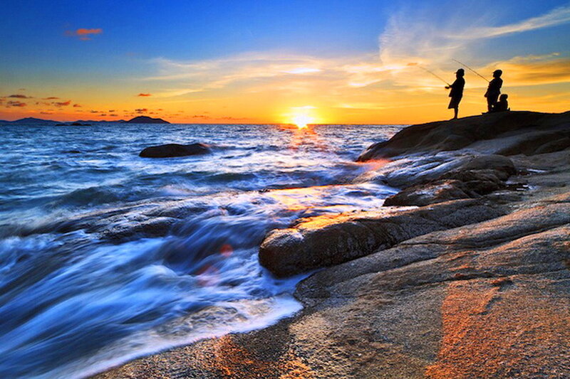 Fishermen on Rocky Shore