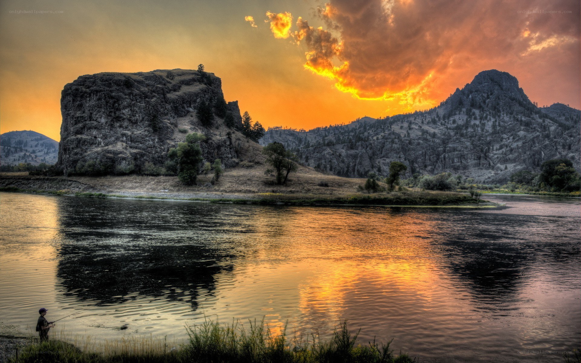 Fishing at sunset by the river
