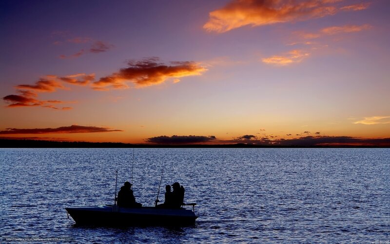 Fishing at sunset on a lake