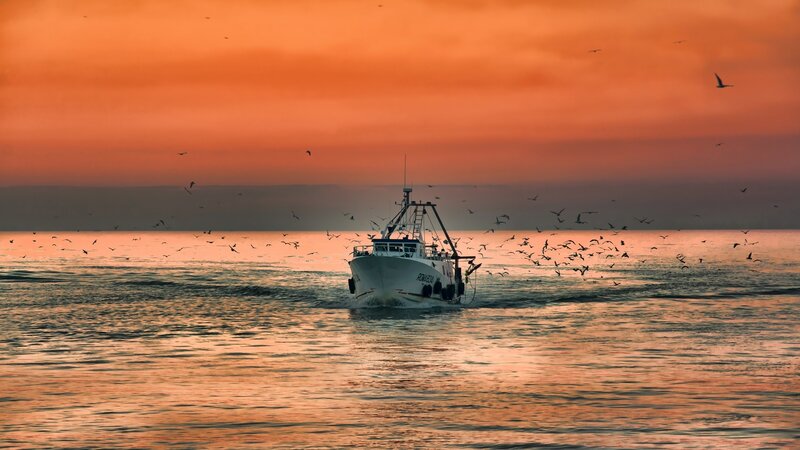 Fishing Boat at Sea — Orange, Dramatic, Sunset