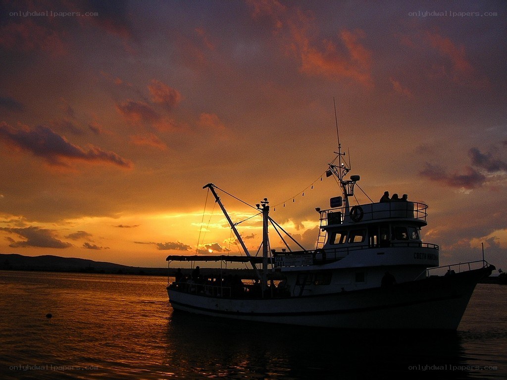 Fishing boat at sunset