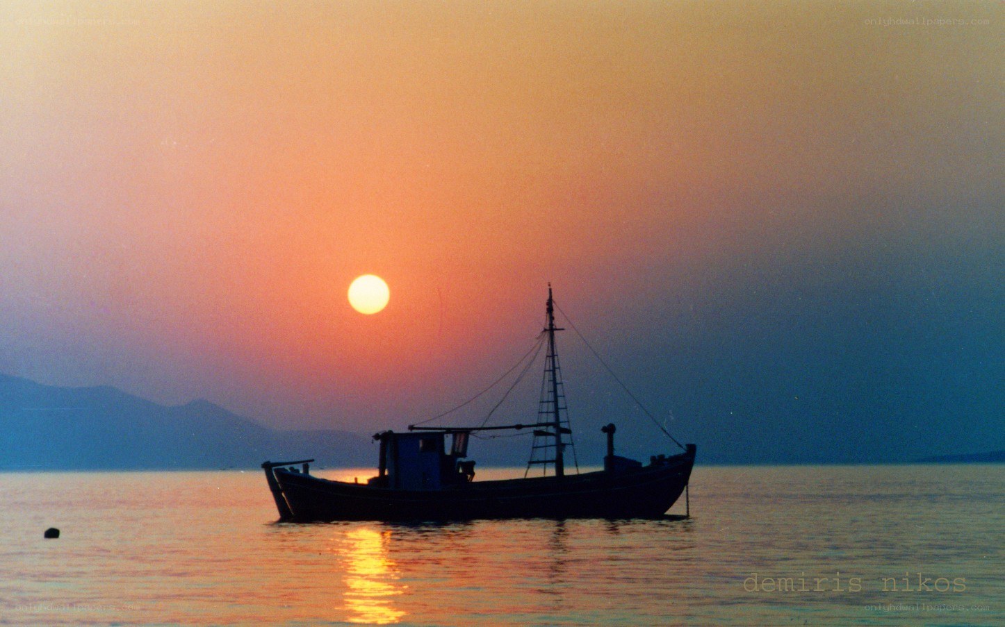 Fishing boat at sunset