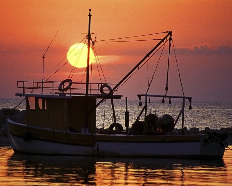 Fishing boat at sunset