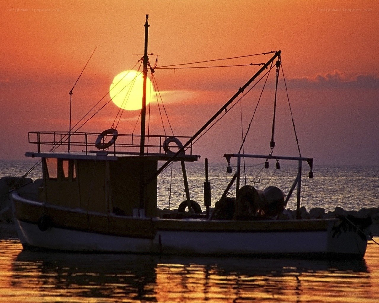 Fishing boat at sunset