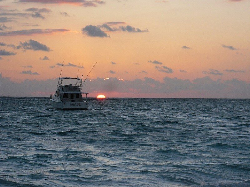 Fishing boat at sunset