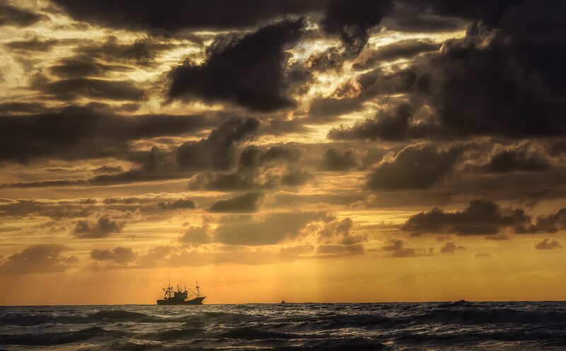 Fishing Boat at Sunset — Gold, Dramatic
