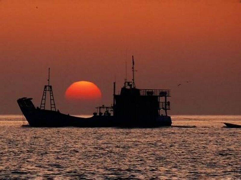 Fishing Boat at Sunset — Orange, Serene, Photograph, Sun