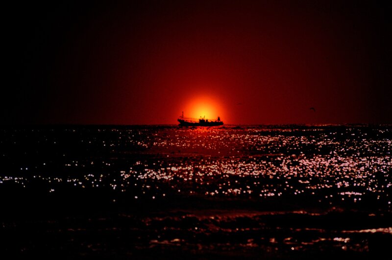 Fishing Boat at Sunset — Red