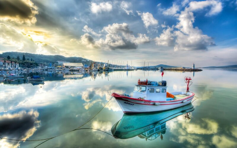 Fishing boat in calm harbor
