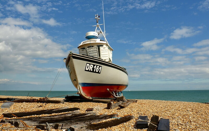 Fishing Boat on Pebble Beach — Blue
