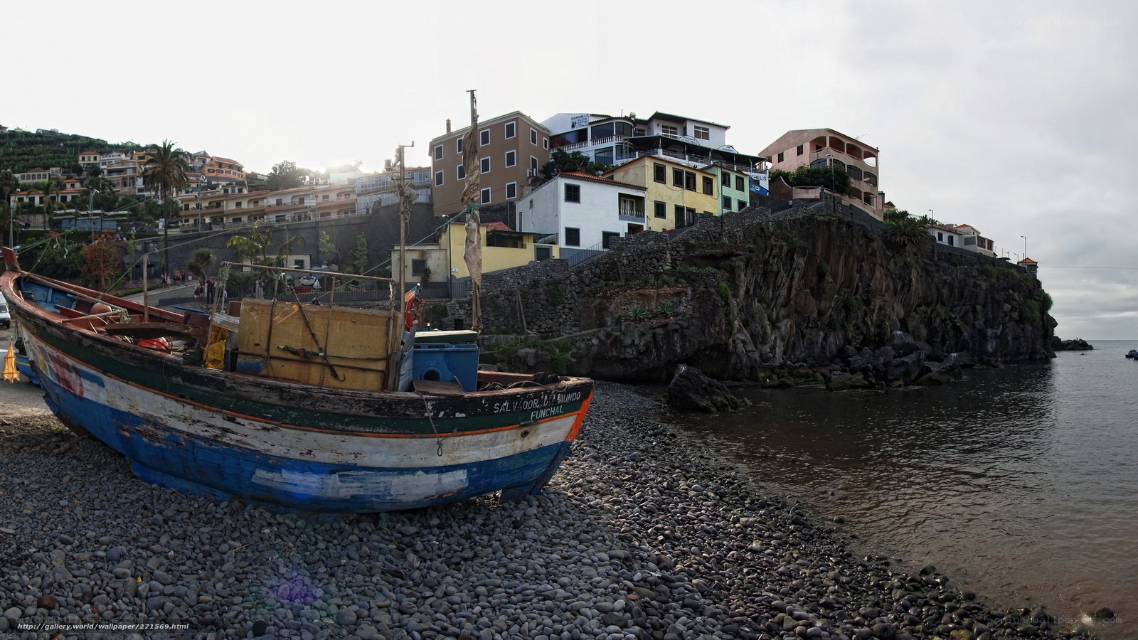Fishing boat on pebble beach