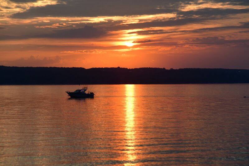 Fishing Boat on Water — Orange