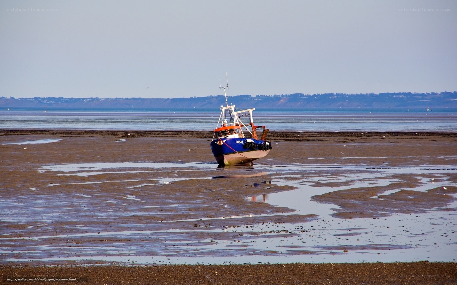 Fishing boat stranded on mudflats