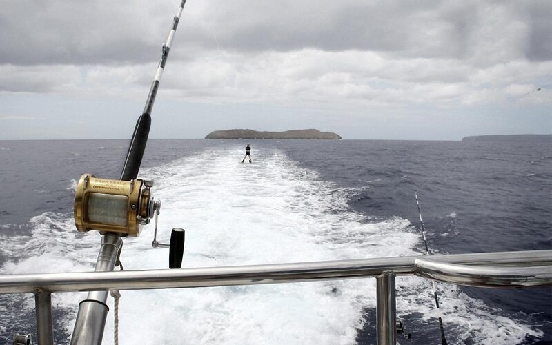 Fishing boat trailing wake