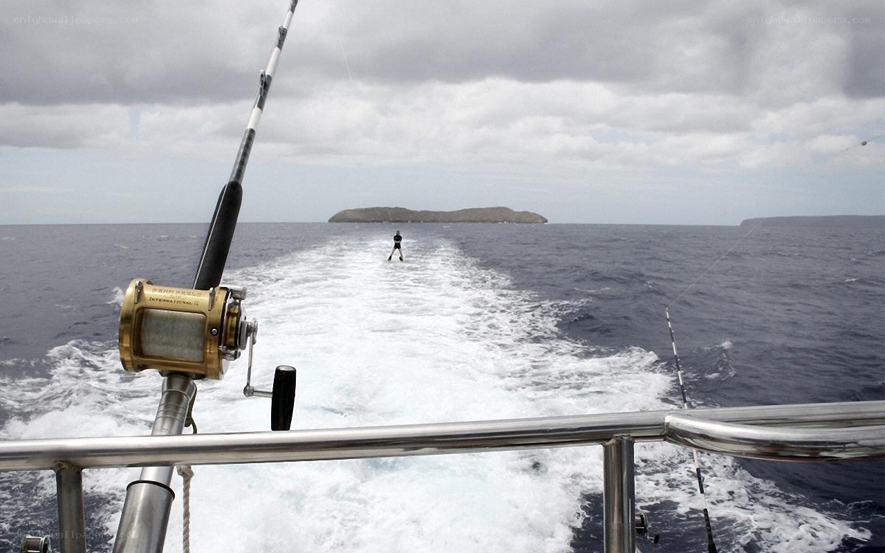 Fishing boat trailing wake