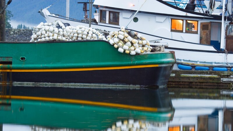 Fishing boat with buoys at dock