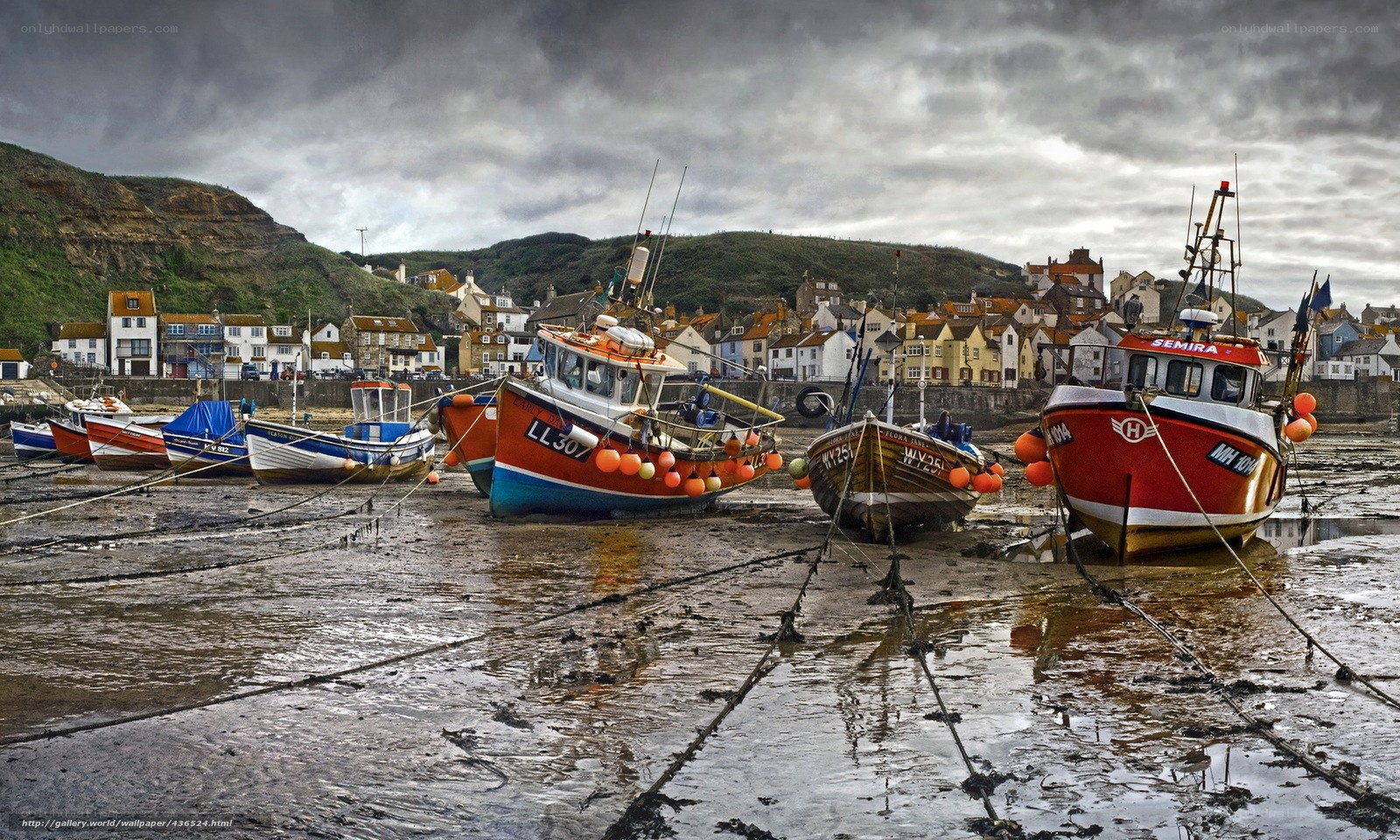 Fishing boats at low tide