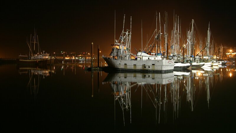 Fishing boats at night in harbor