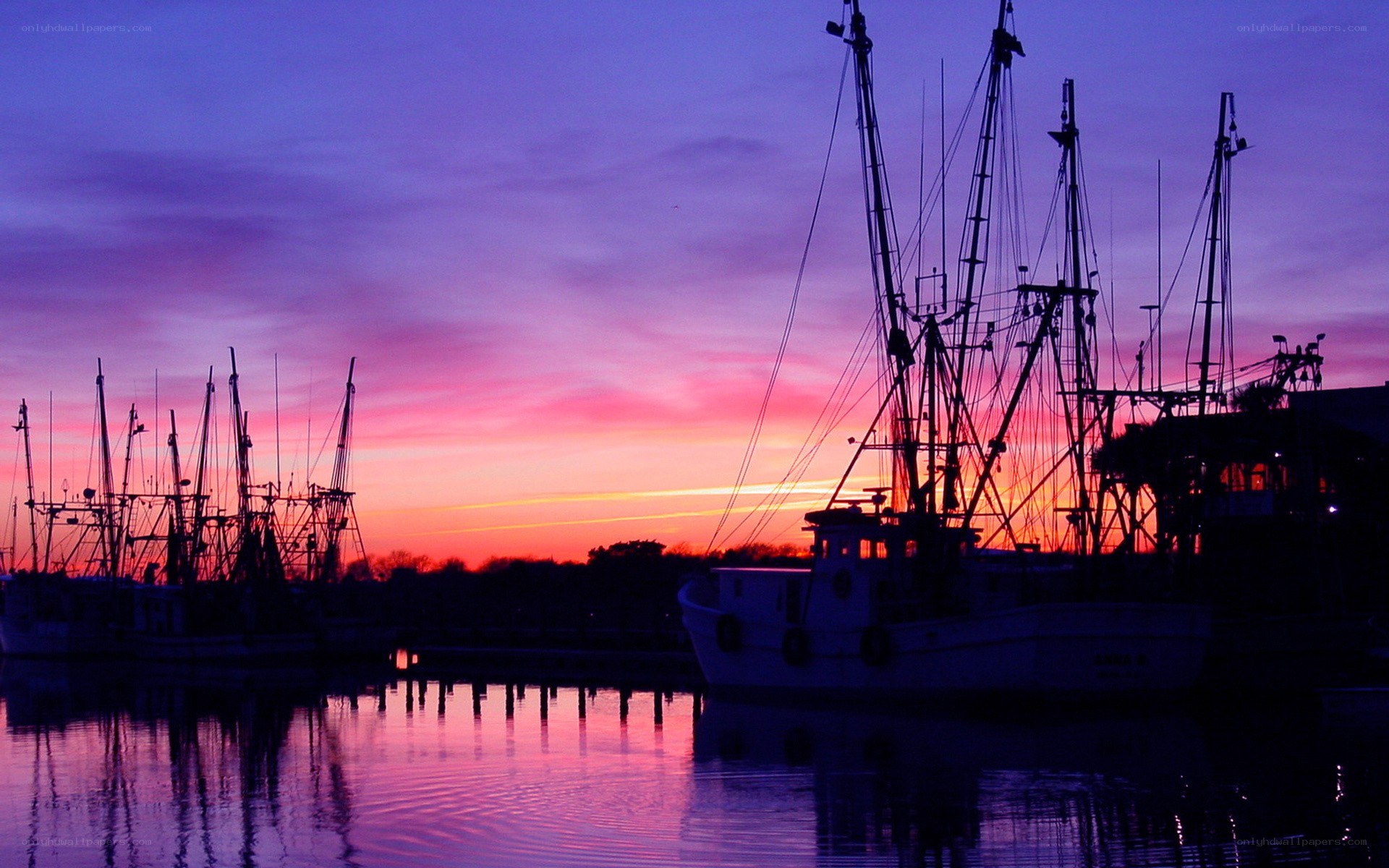 Fishing boats at sunset