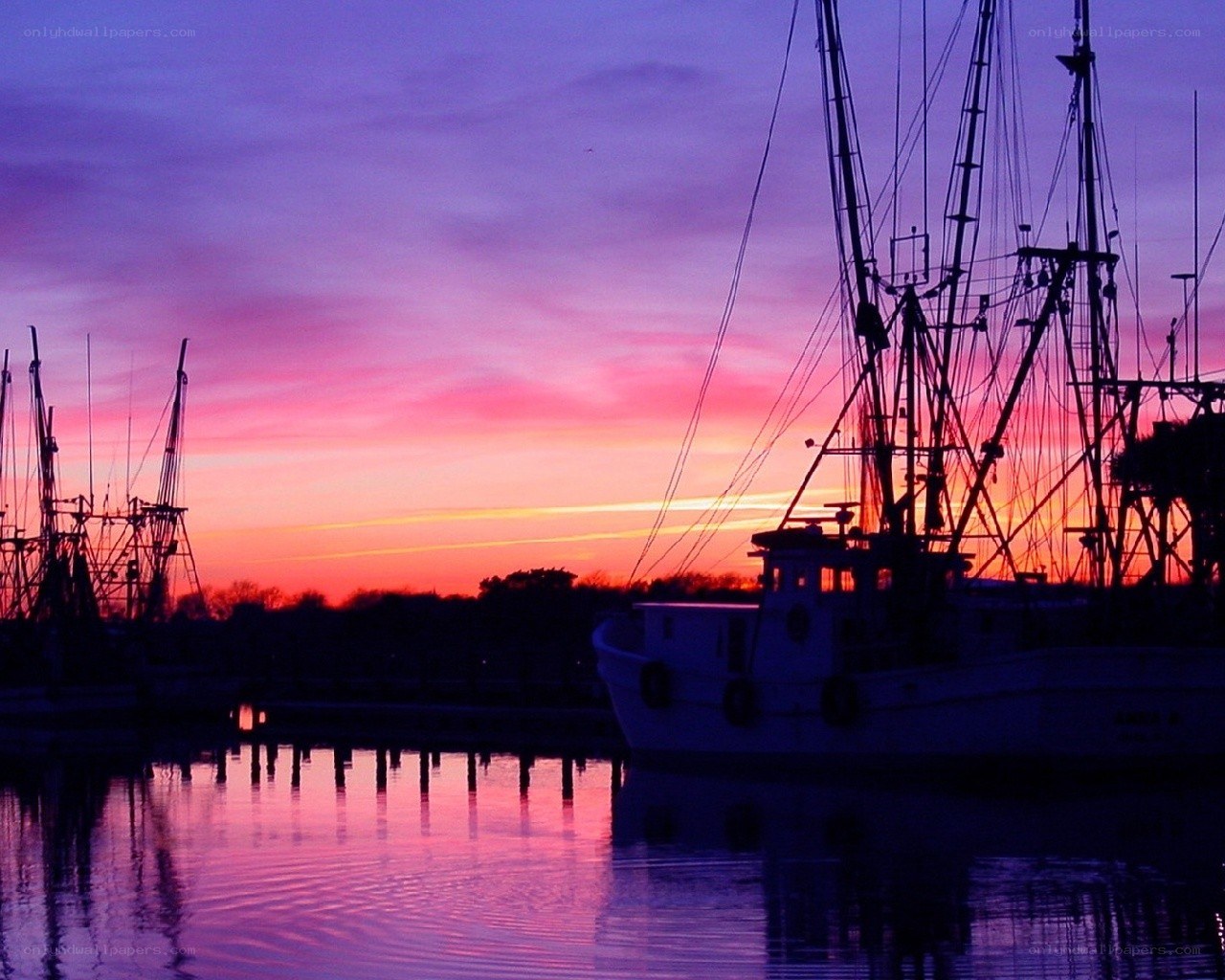 Fishing boats at sunset