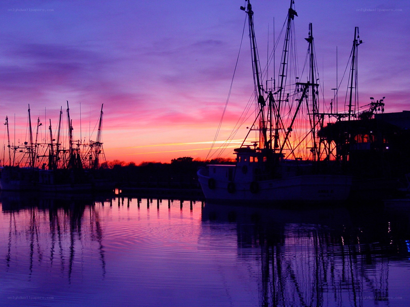 Fishing boats at sunset