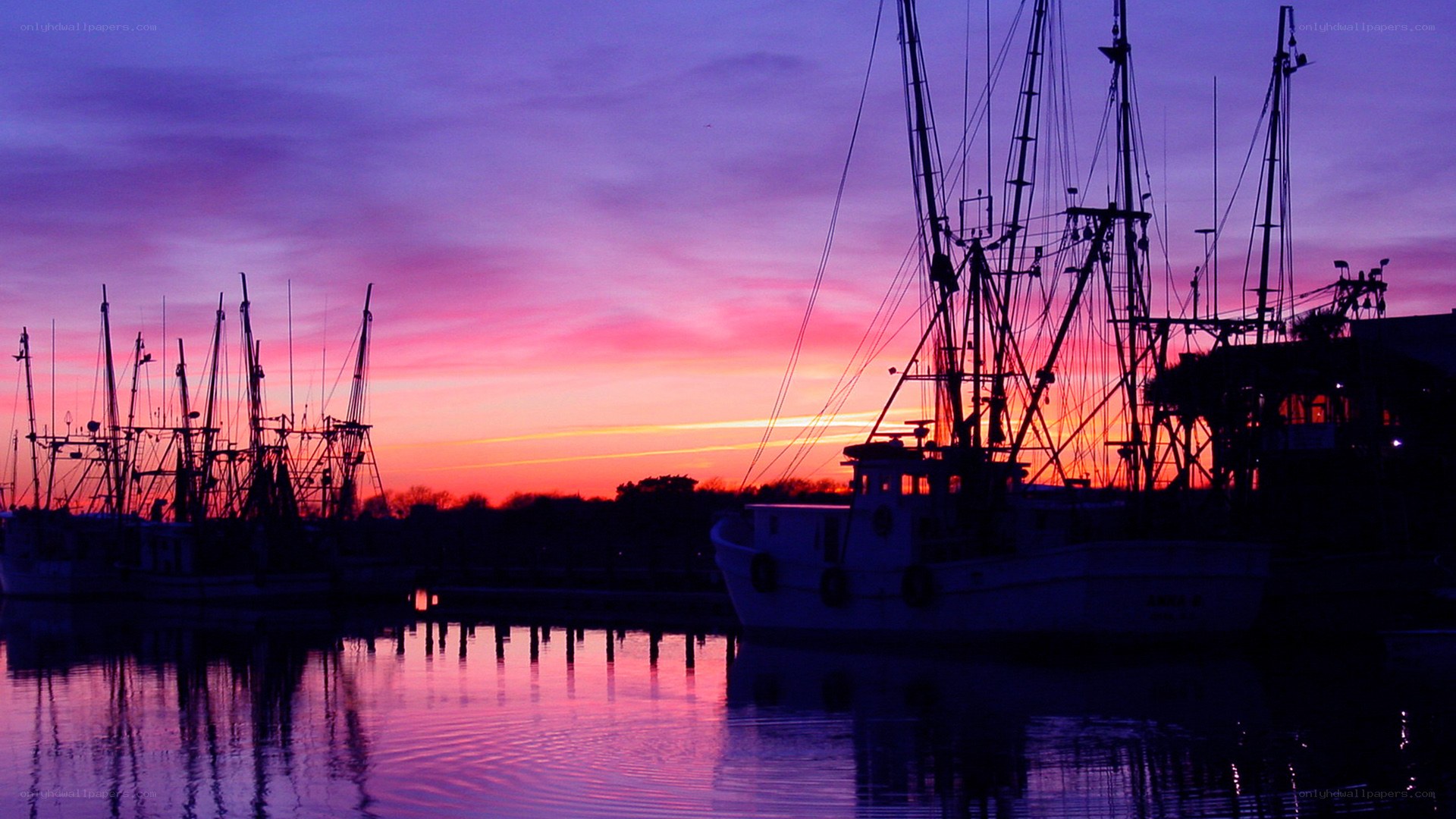 Fishing boats at sunset