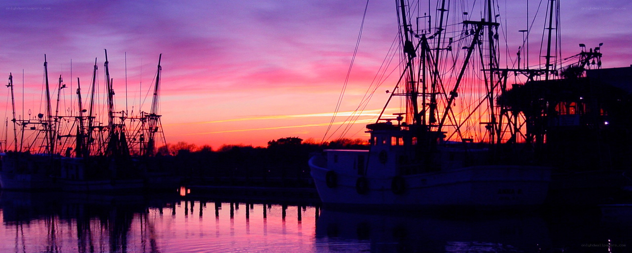 Fishing boats at sunset