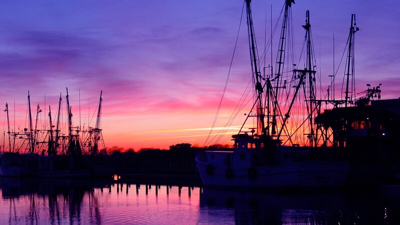 Fishing boats at sunset