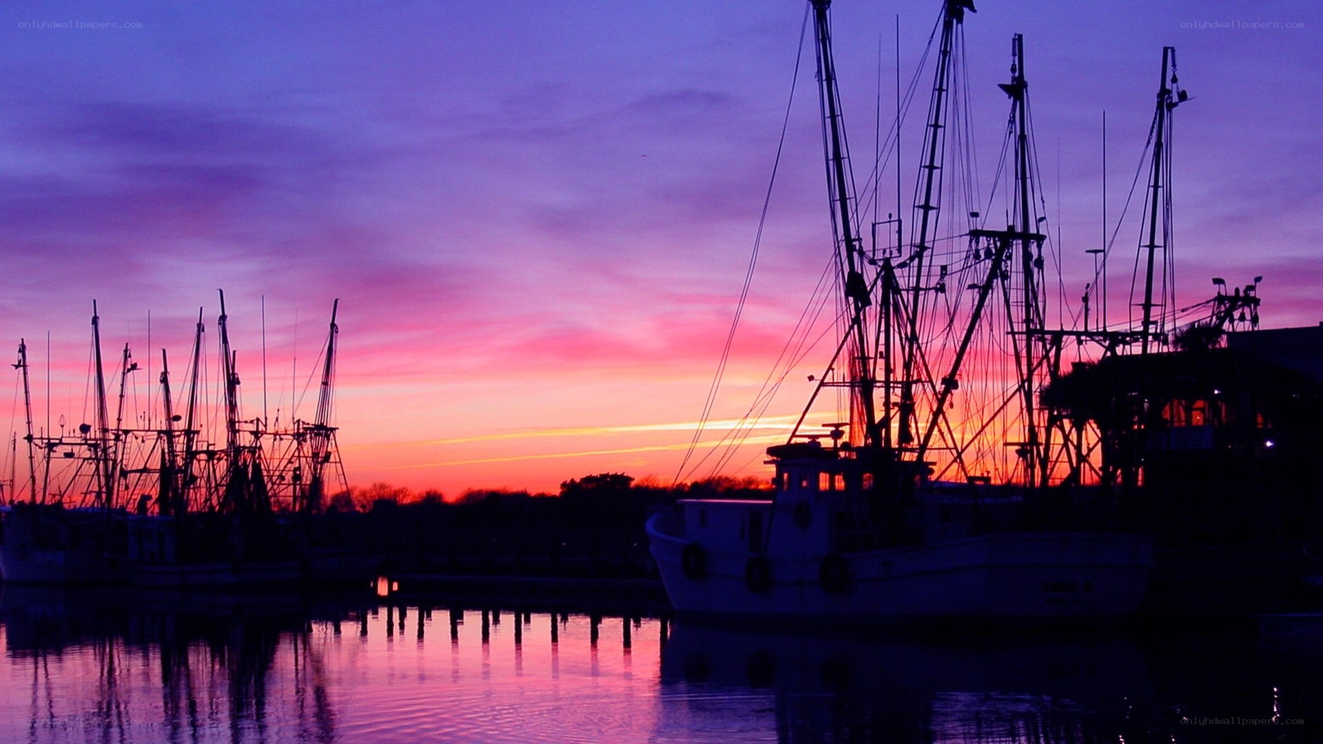 Fishing boats at sunset