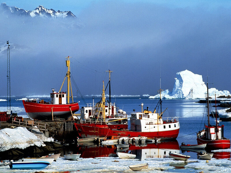 Fishing boats in an icy harbor