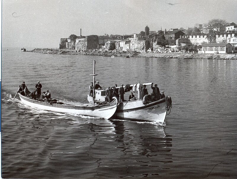 Fishing boats near a coastal town
