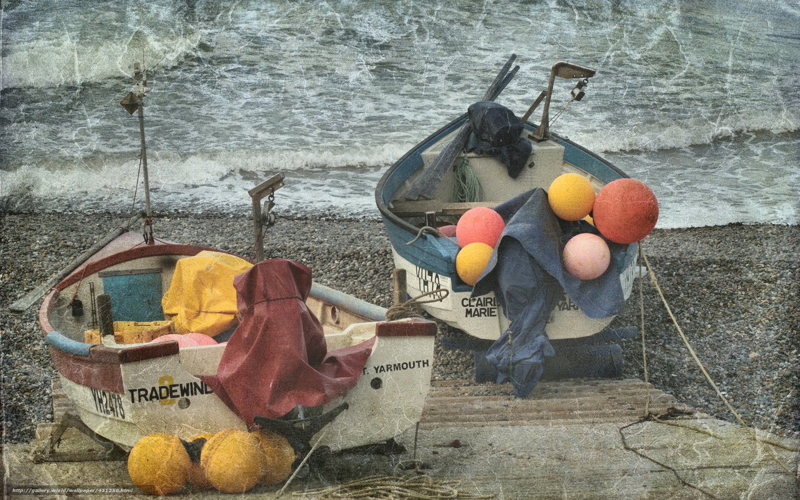 Fishing boats on a pebble beach