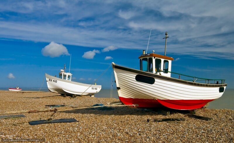 Fishing boats on a pebble beach