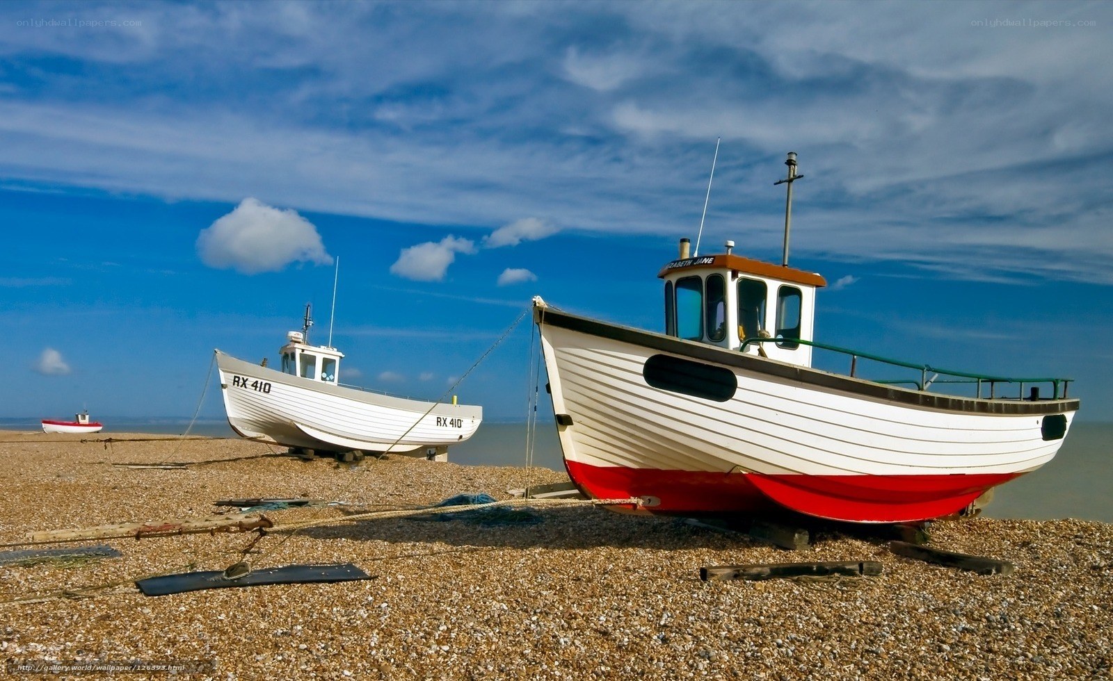 Fishing boats on a pebble beach