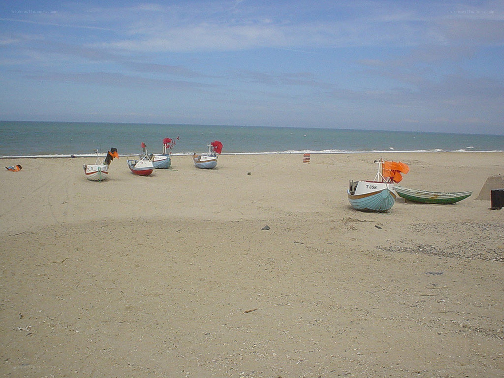 Fishing boats on a sandy beach