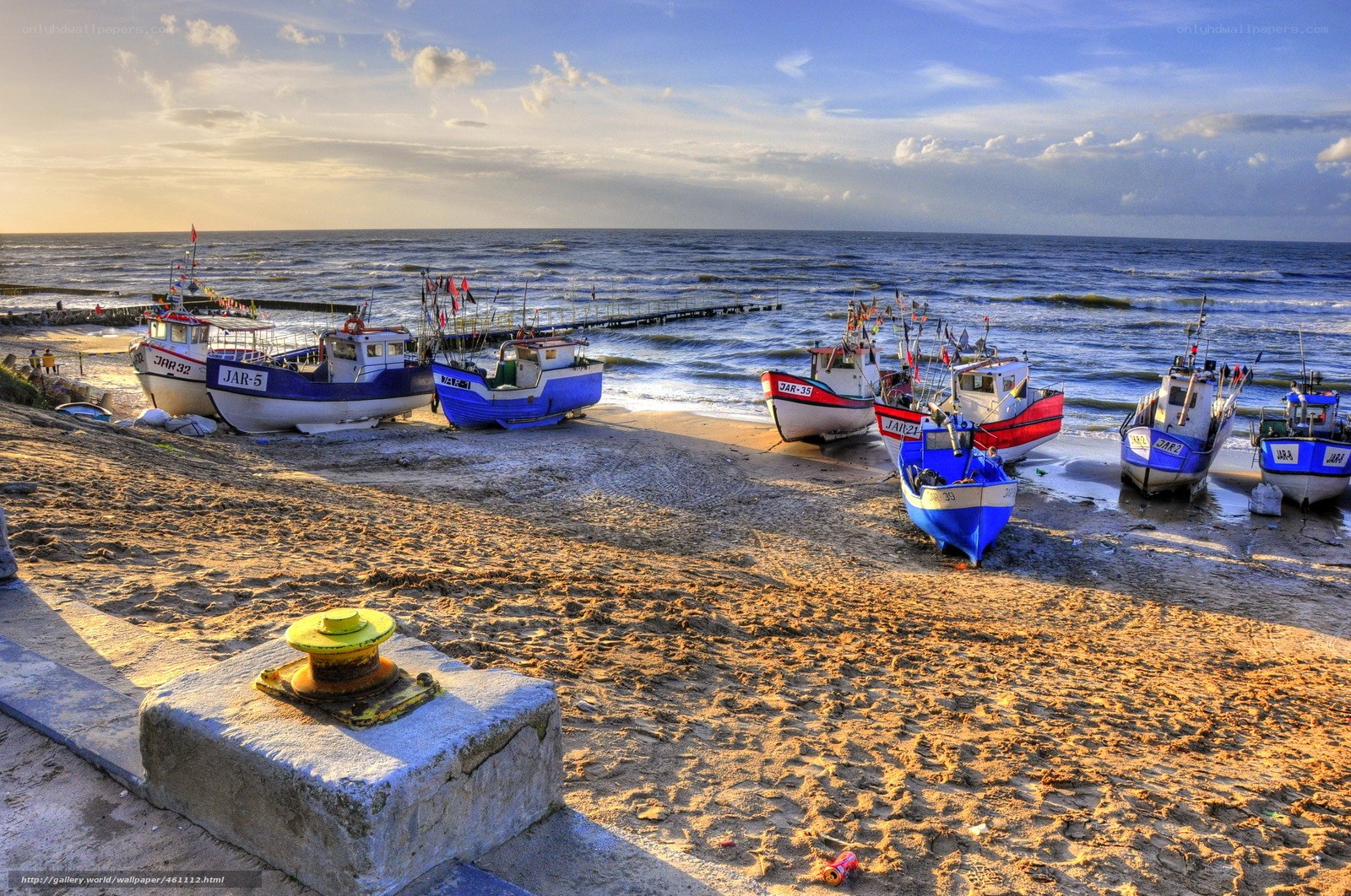 Fishing boats on a sandy beach