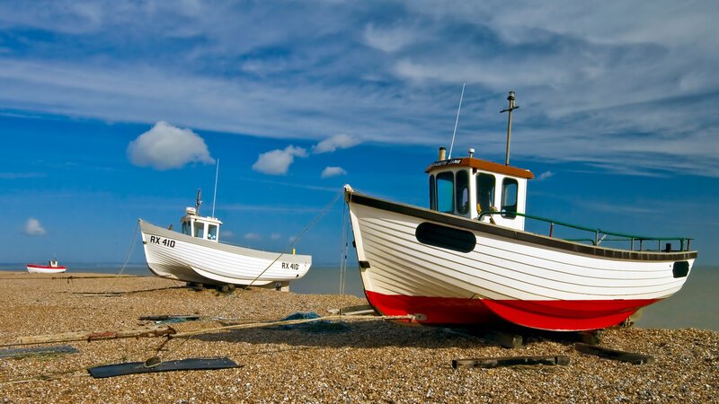 Fishing Boats on Beach — Blue, Serene, Afternoon, Photograph, Pebble Beach, Sky, White, Red