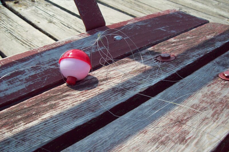 fishing float on wooden bench