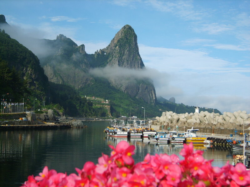 Fishing harbor with mountain backdrop